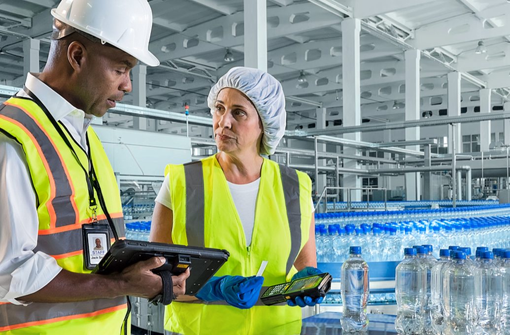 two workers in assembly line warehouse