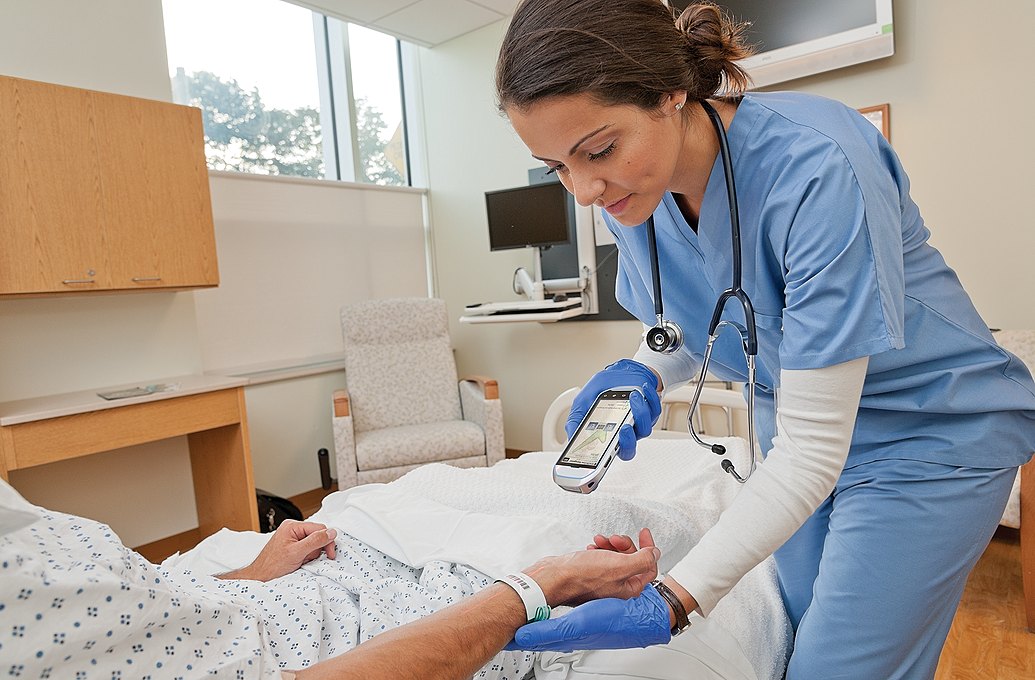 nurse scanning patient wristband