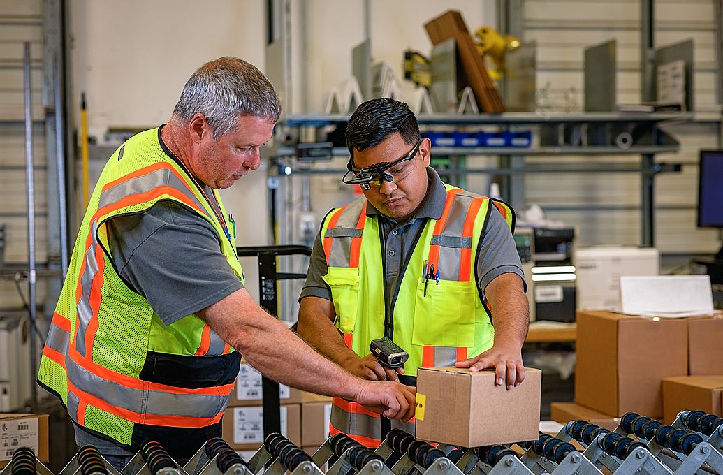 two workers in warehouse