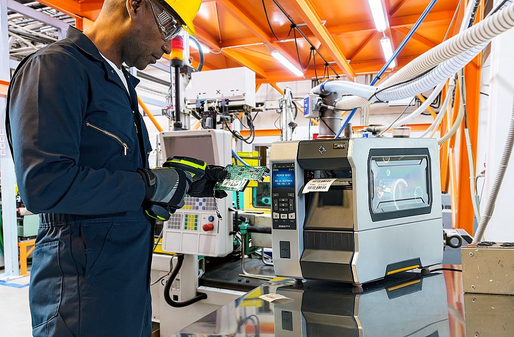 worker scanning label in factory